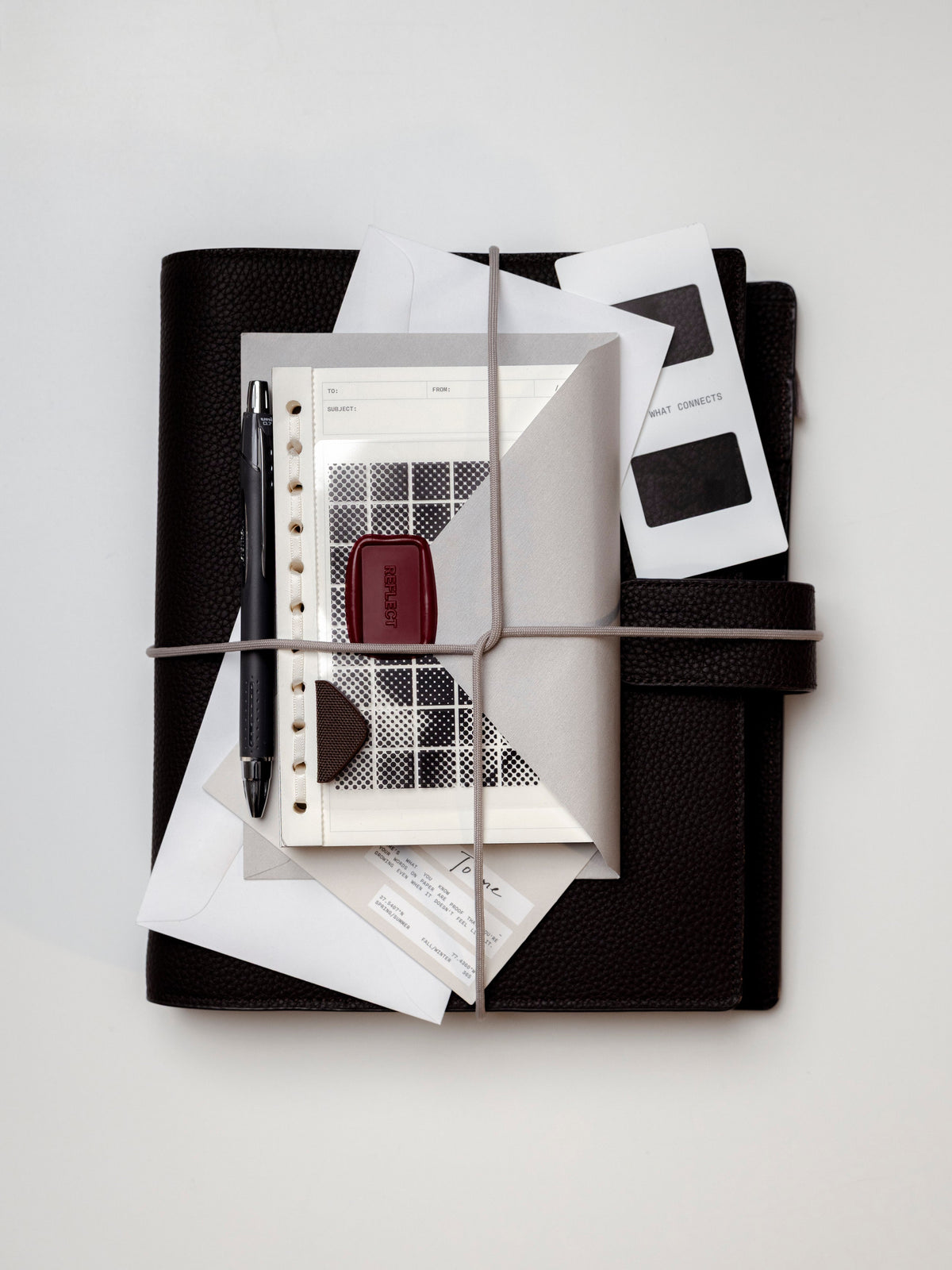 The Foundations 6-Ring Leather Agenda serves as a curated hub, bundled here with the March 2026 Intention Box essentials. The set includes a sleek black pen, chic inserts and a signature deep red wax seal, all secured for a season of thoughtful "sending."