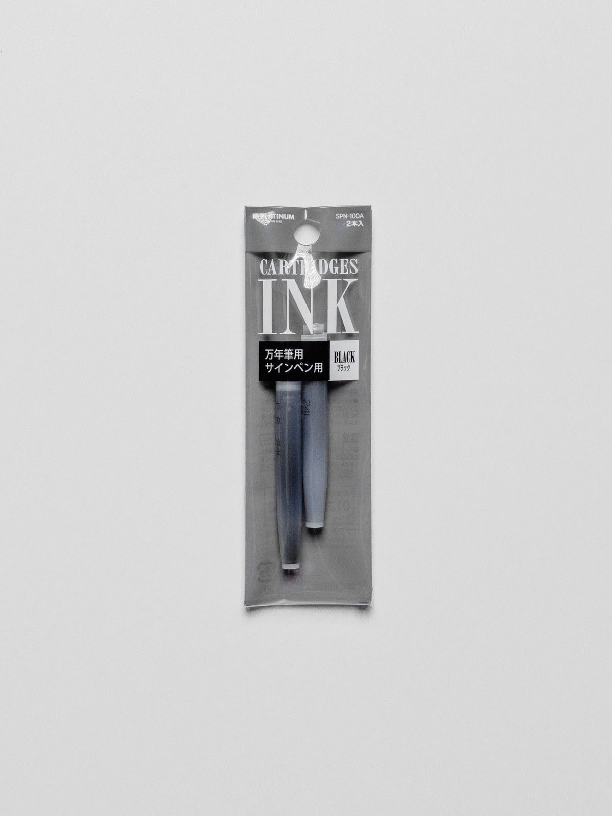 Black ink refill in its packaging displayed on a neutral background.