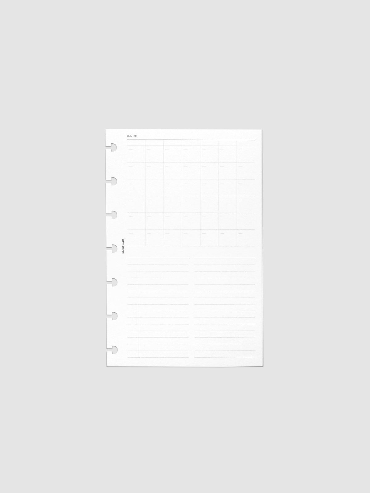 Monthly Fold Out Planner Insert Set of 2, HP Mini 7-Disc Punch, one white insert folded closed and centered flat in frame, seven disc notches cut along the left edge