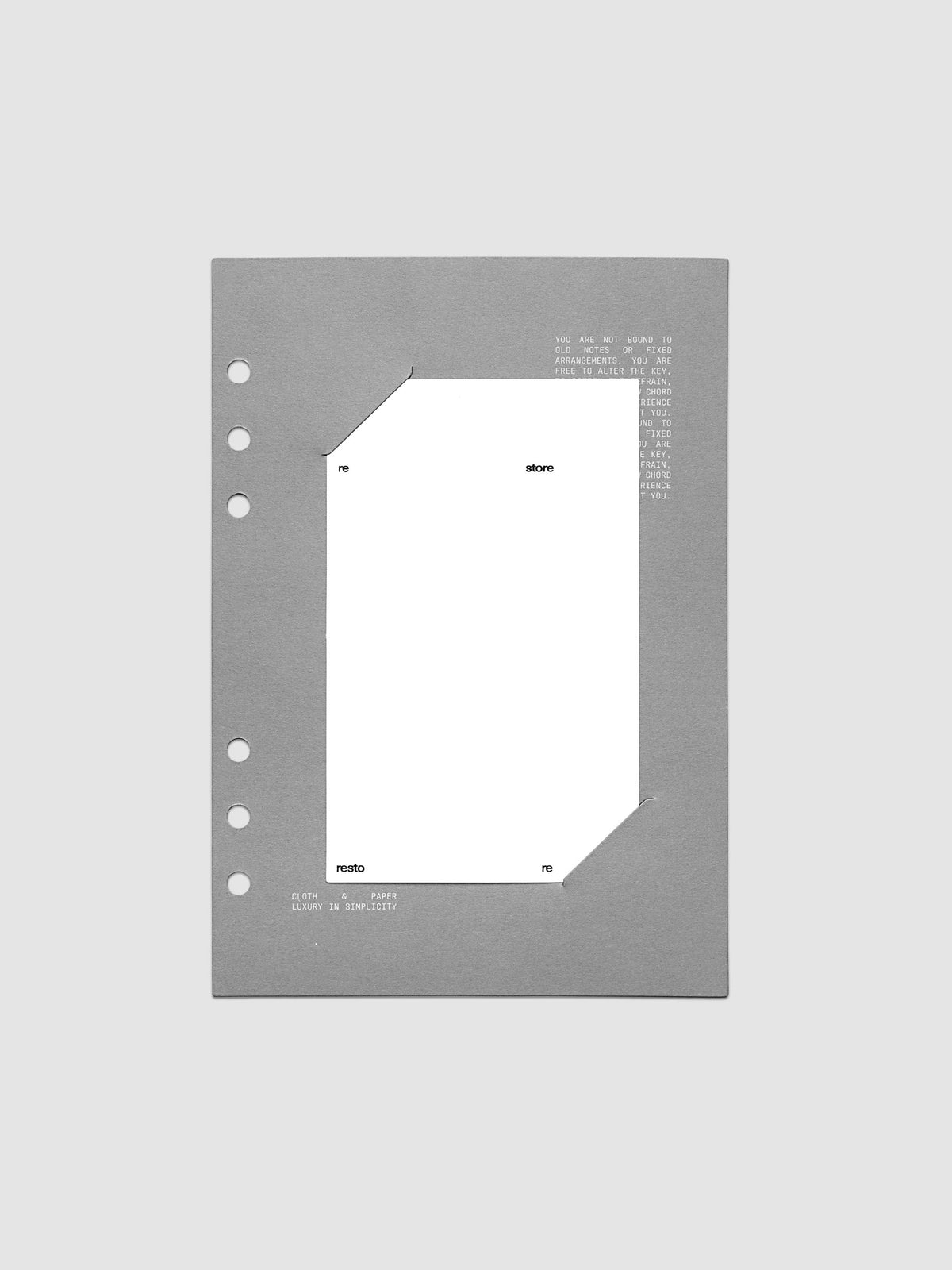 Grey cardstock planner dashboard with white plastic card inserted in slits with white printed text shown in size A5 for ring bound planners.