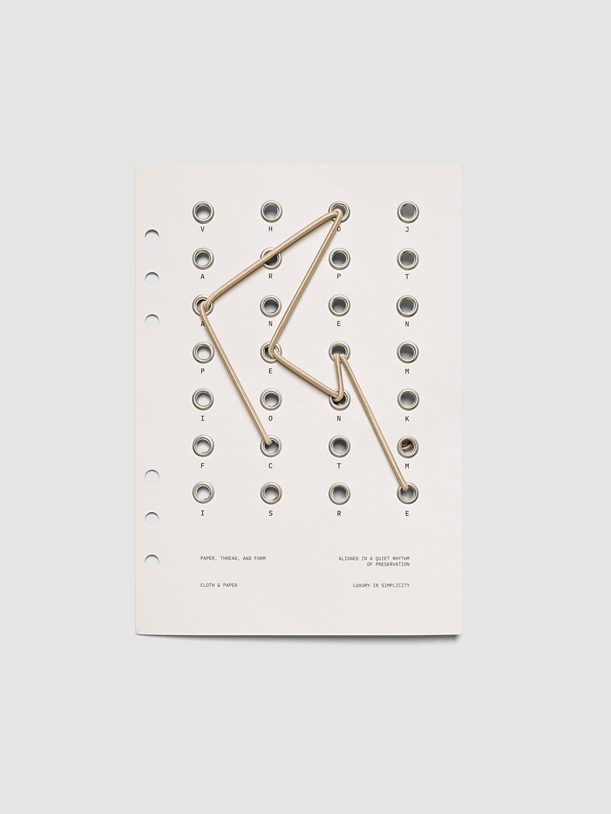 Cadence Dashboard with grommets and string on beige cardstock shown in size A5 for 6-ring planners and notebooks.