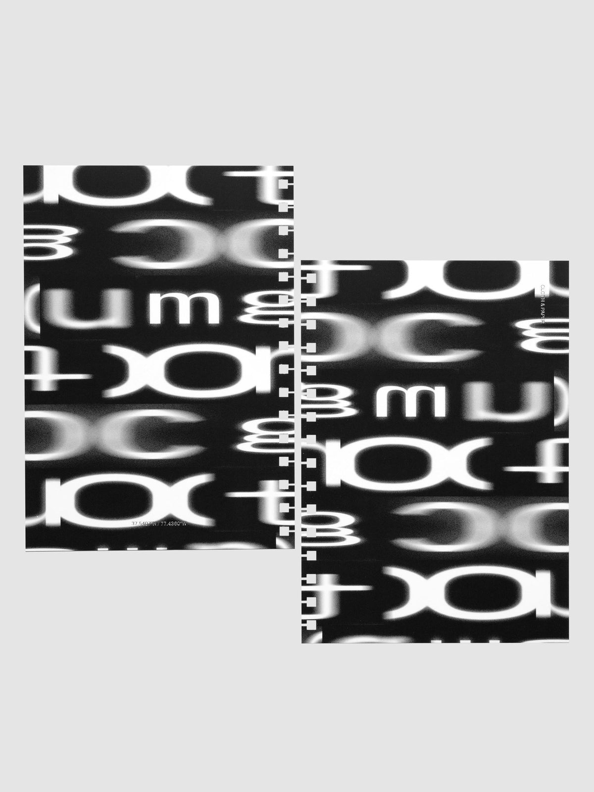 Front and back Spiral Notebook dashboards in the pattern Blurred Letters shown in size A5 against a neutral background.