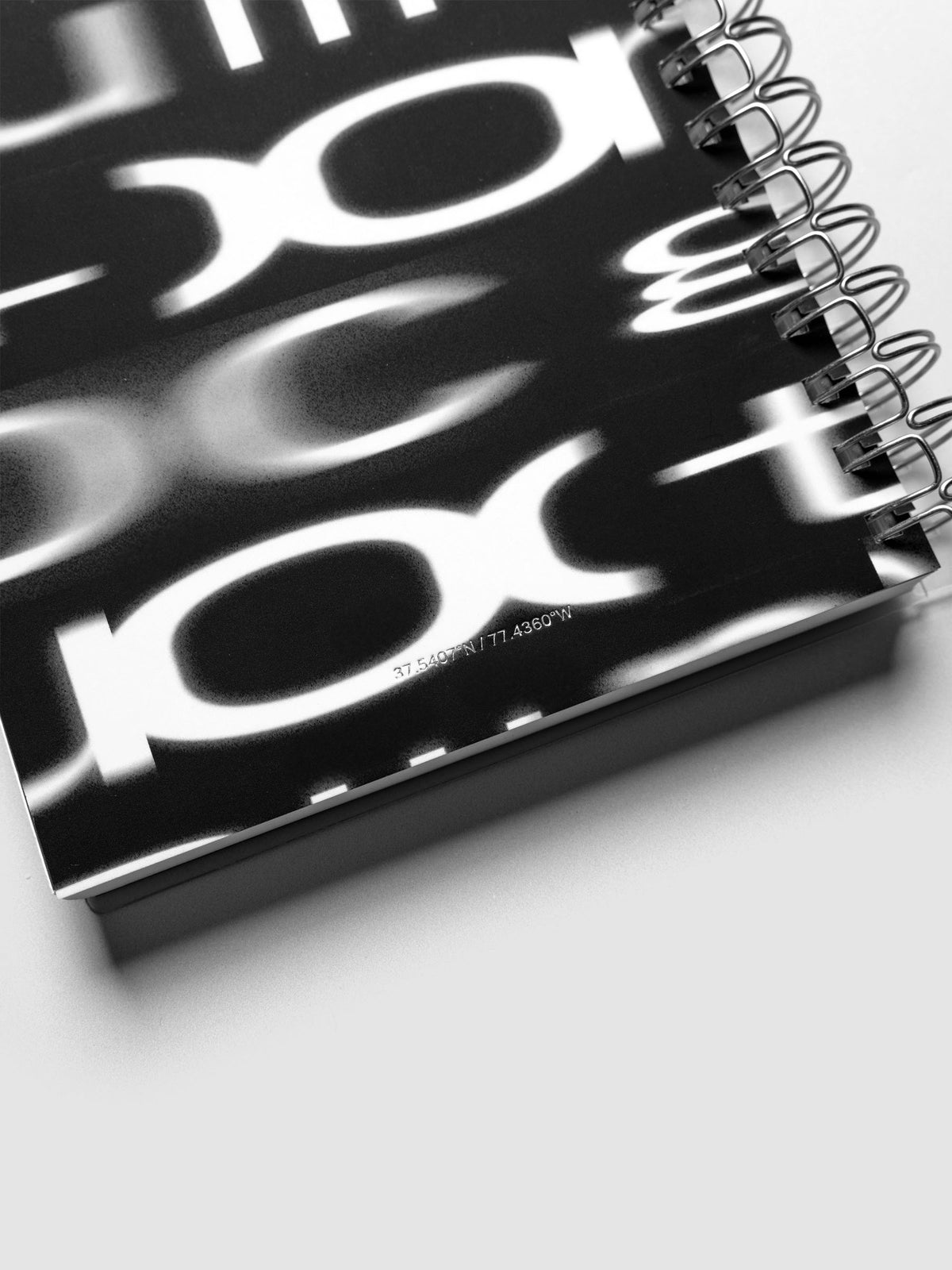Detail view of the Spiral Notebook dashboard in the pattern Blurred Letters shown in size A5 against a neutral background.