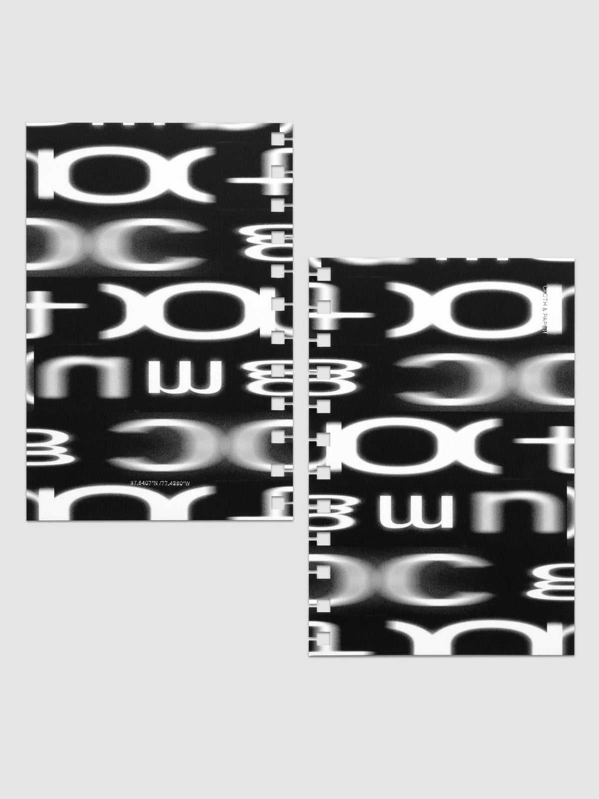Front and back Spiral Notebook dashboards in the pattern Blurred Letters shown in size CP Petite against a neutral background.