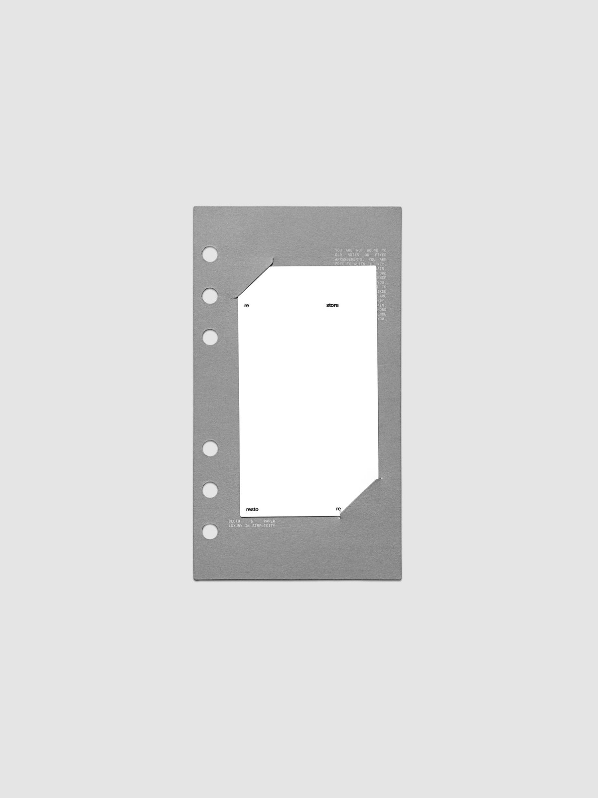 Grey cardstock planner dashboard with white plastic card inserted in slits with white printed text shown in size Personal for ring bound planners.