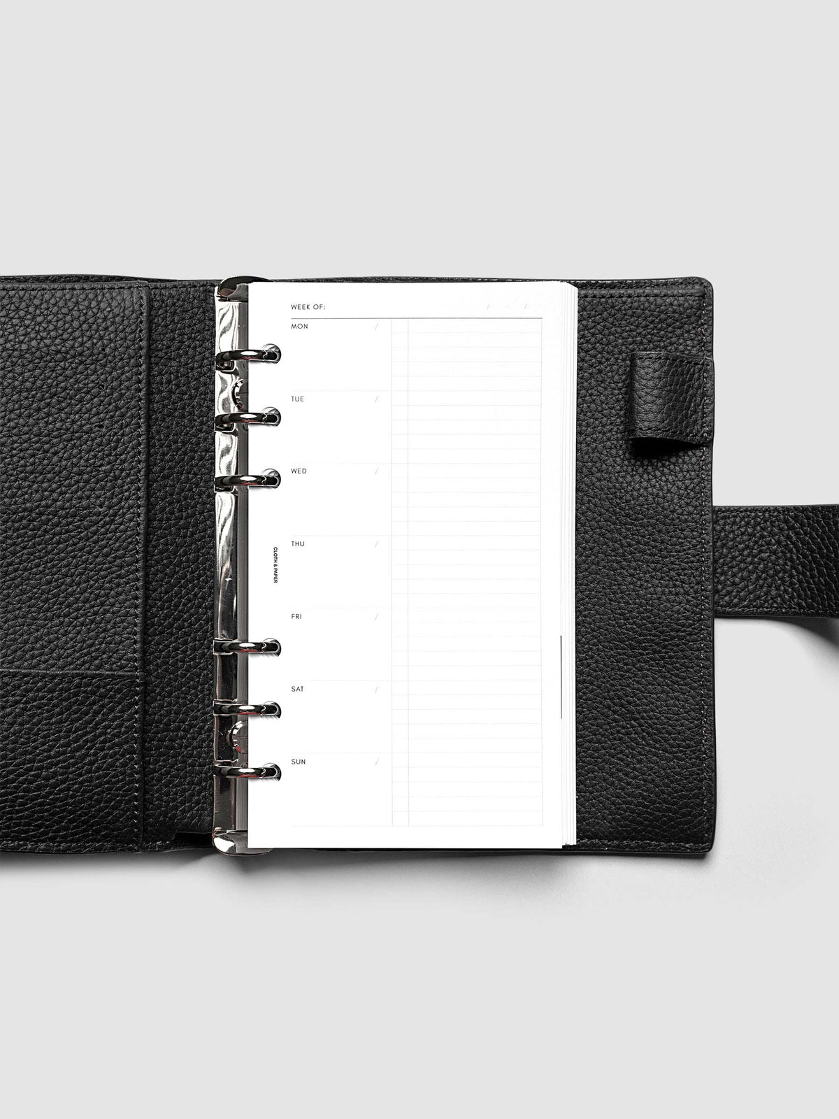 Weekly Checklist Inserts shown in size Personal inside a black leather agenda.