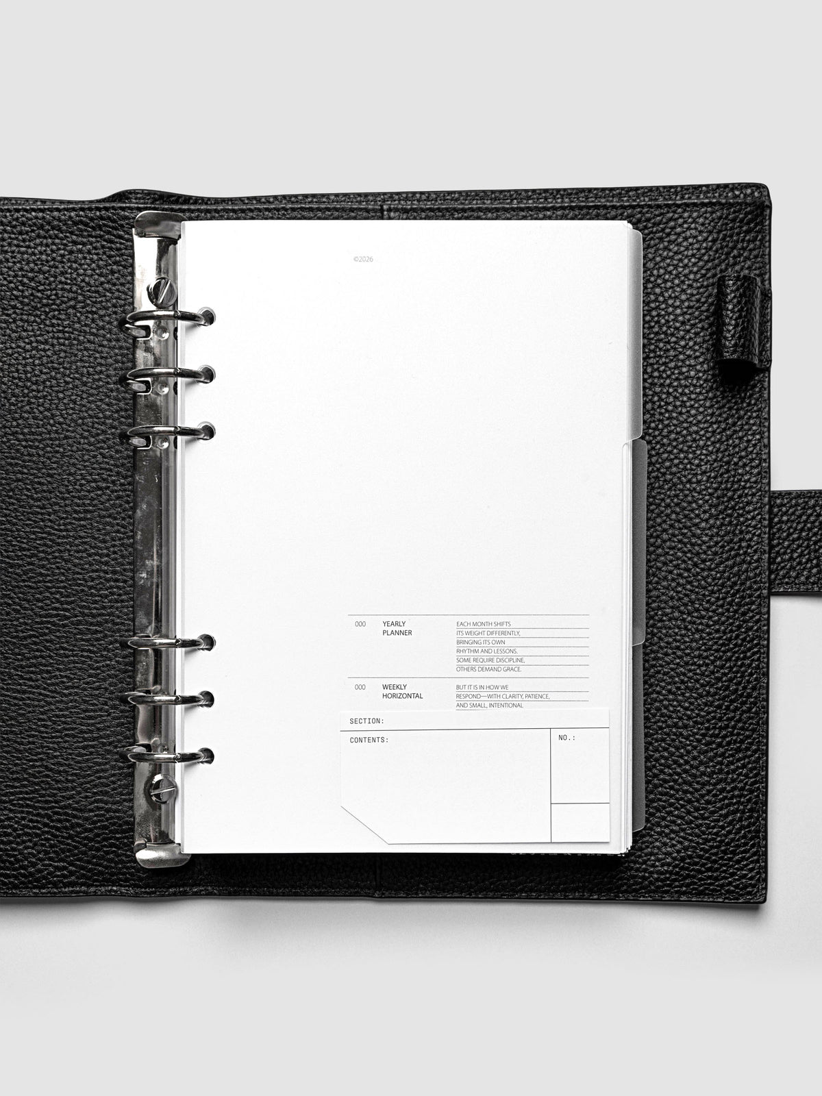 Clear side tab dividers sized for A5 planners shown in use with a blank label with headers section, content, and no.