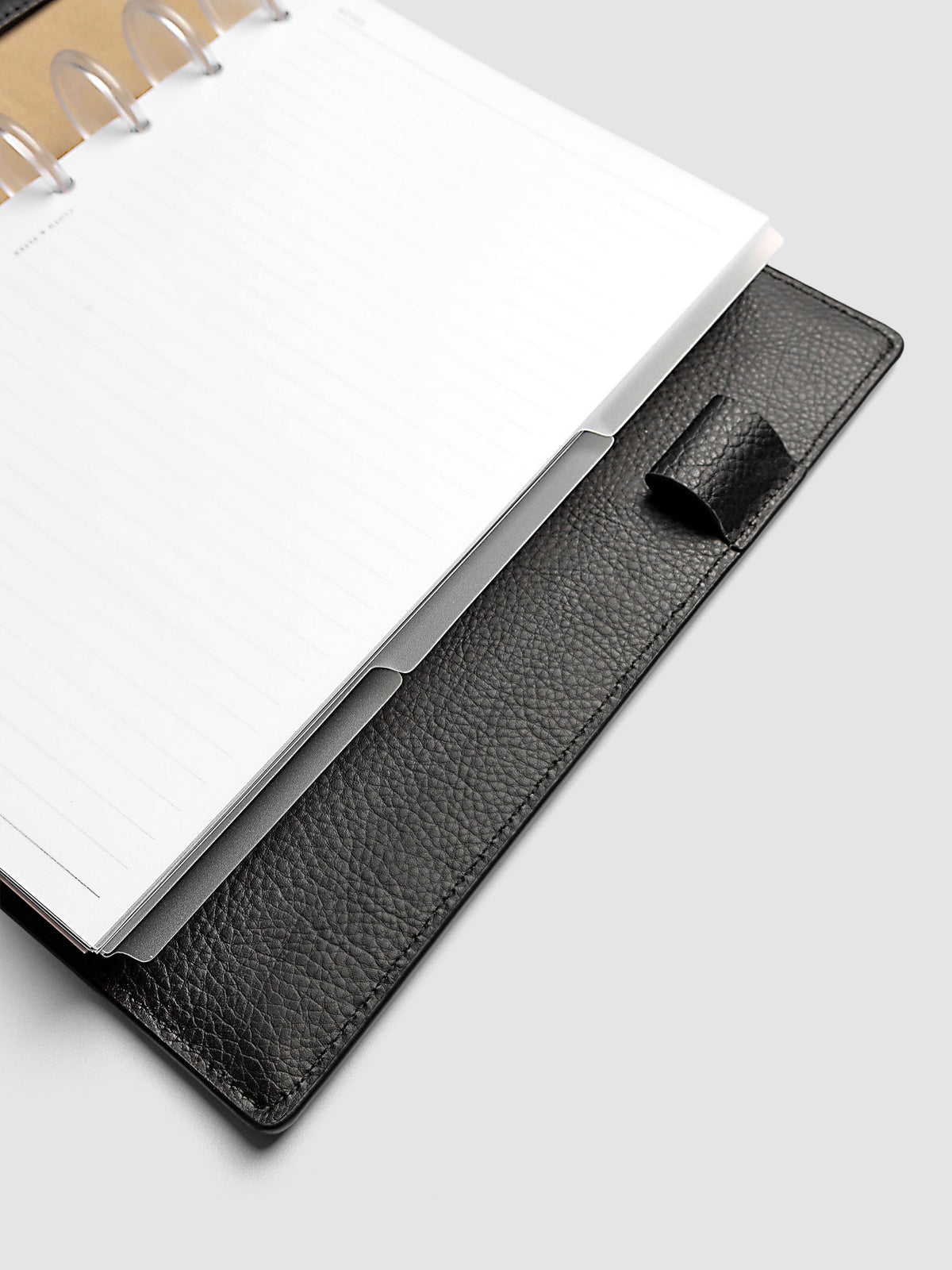 Blank, transparent side tab divider set shown in a Half Letter planner.