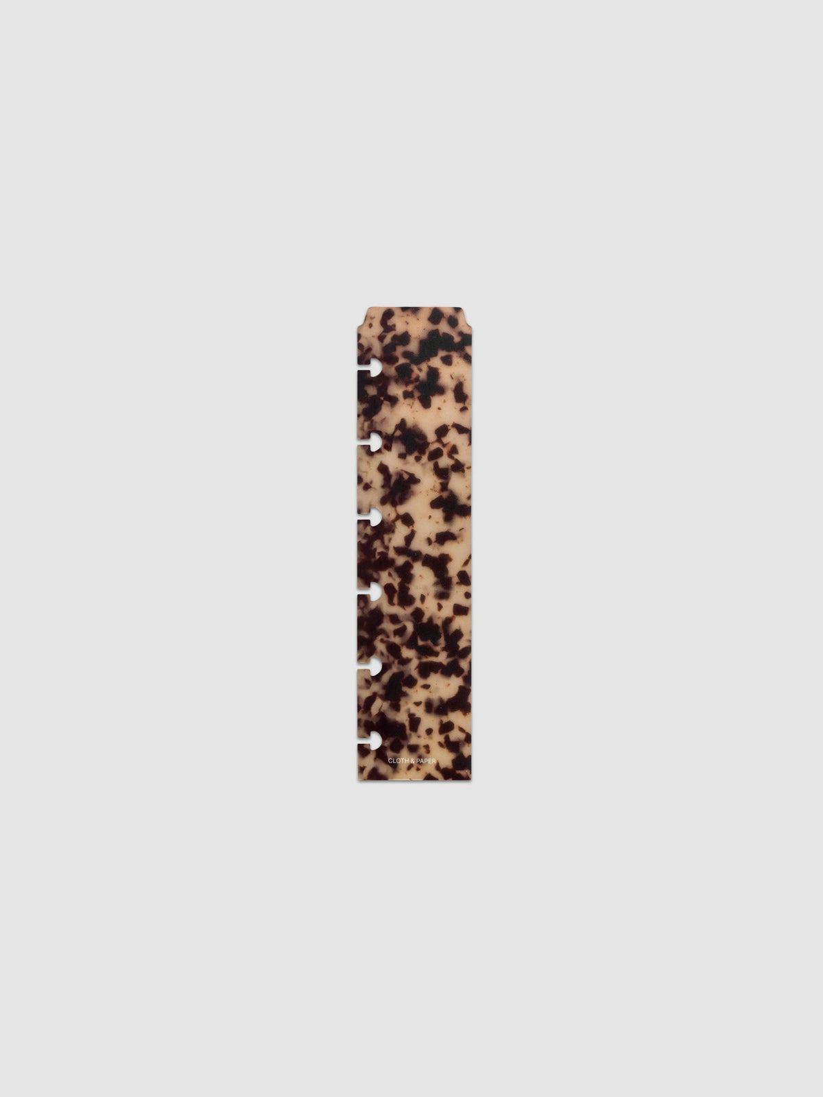 One narrow page marker in tortoiseshell pattern, shown in size CP Petite.