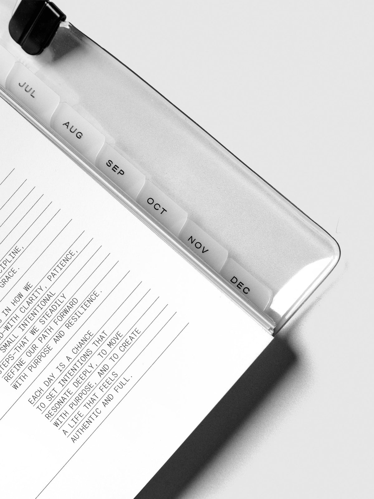 Close up of monthly side tab dividers included with the 2026 Dated Planner Bundle Horizontal Weekly Monday Start in size Half Letter.