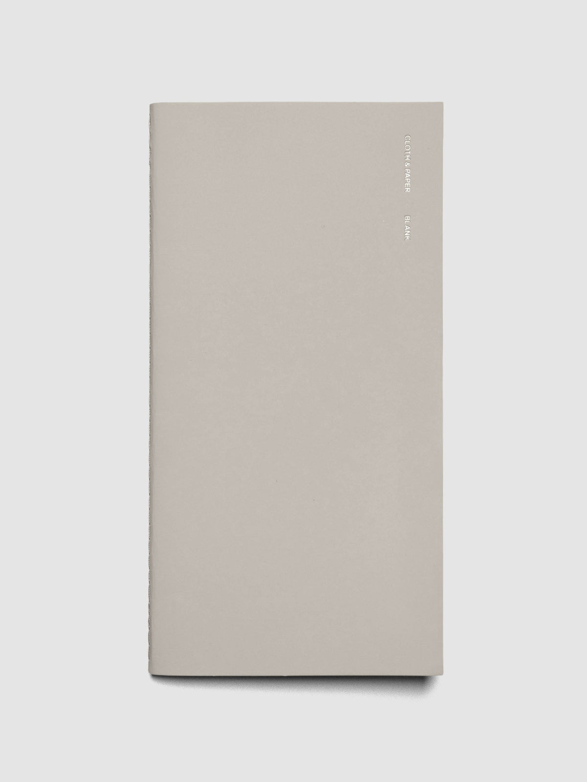 Travel Notebook in size A5 Slim in color Angora with Blank pages shown closed.