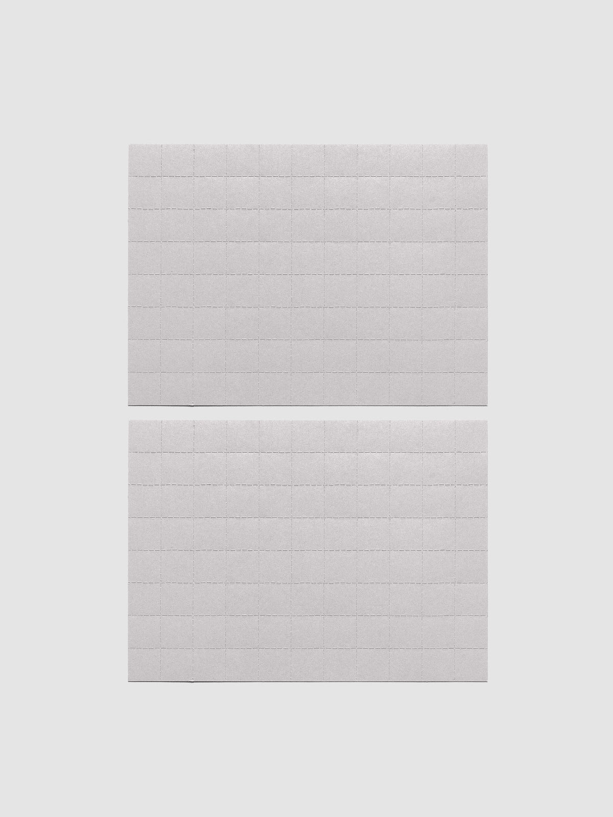 Two sheets of grey tear-off stickers