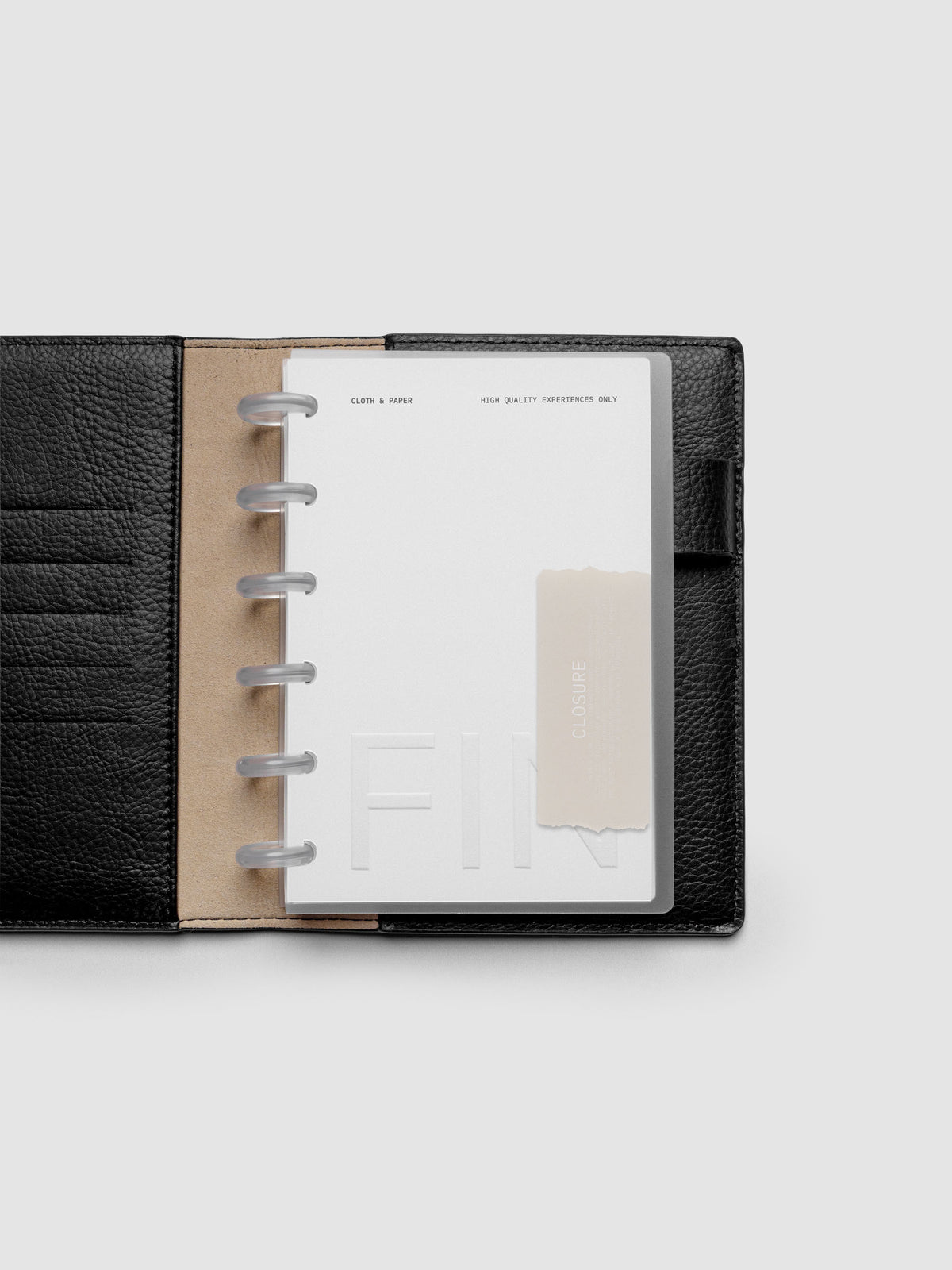 Closure Planner Dashboard + Cover Set in size CP Petite shown discbound in a black leather folio.