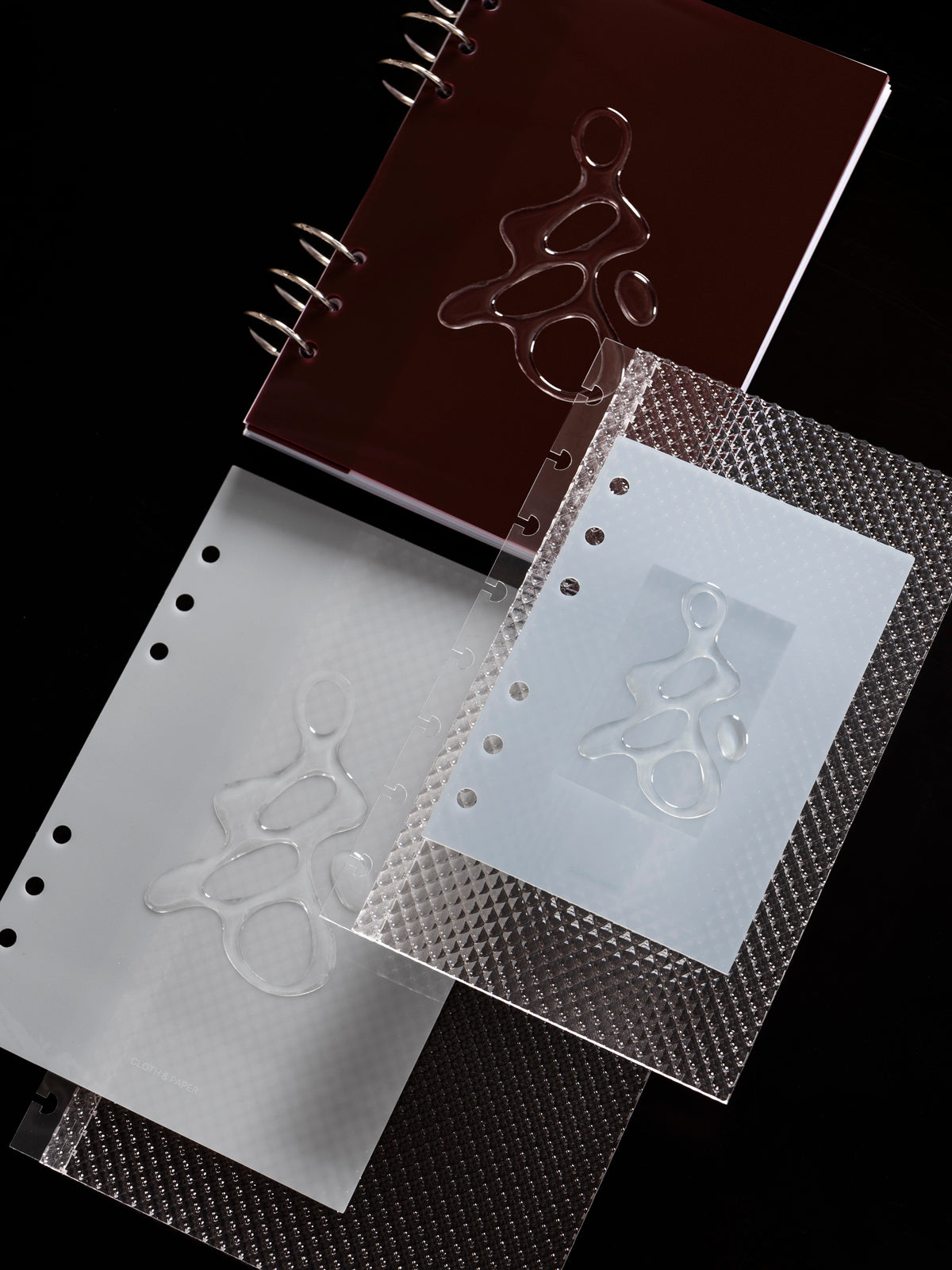 All three colors of the Gloss Form Planner Dashboard shown with the Studded Planner Dashboard against a dark background.