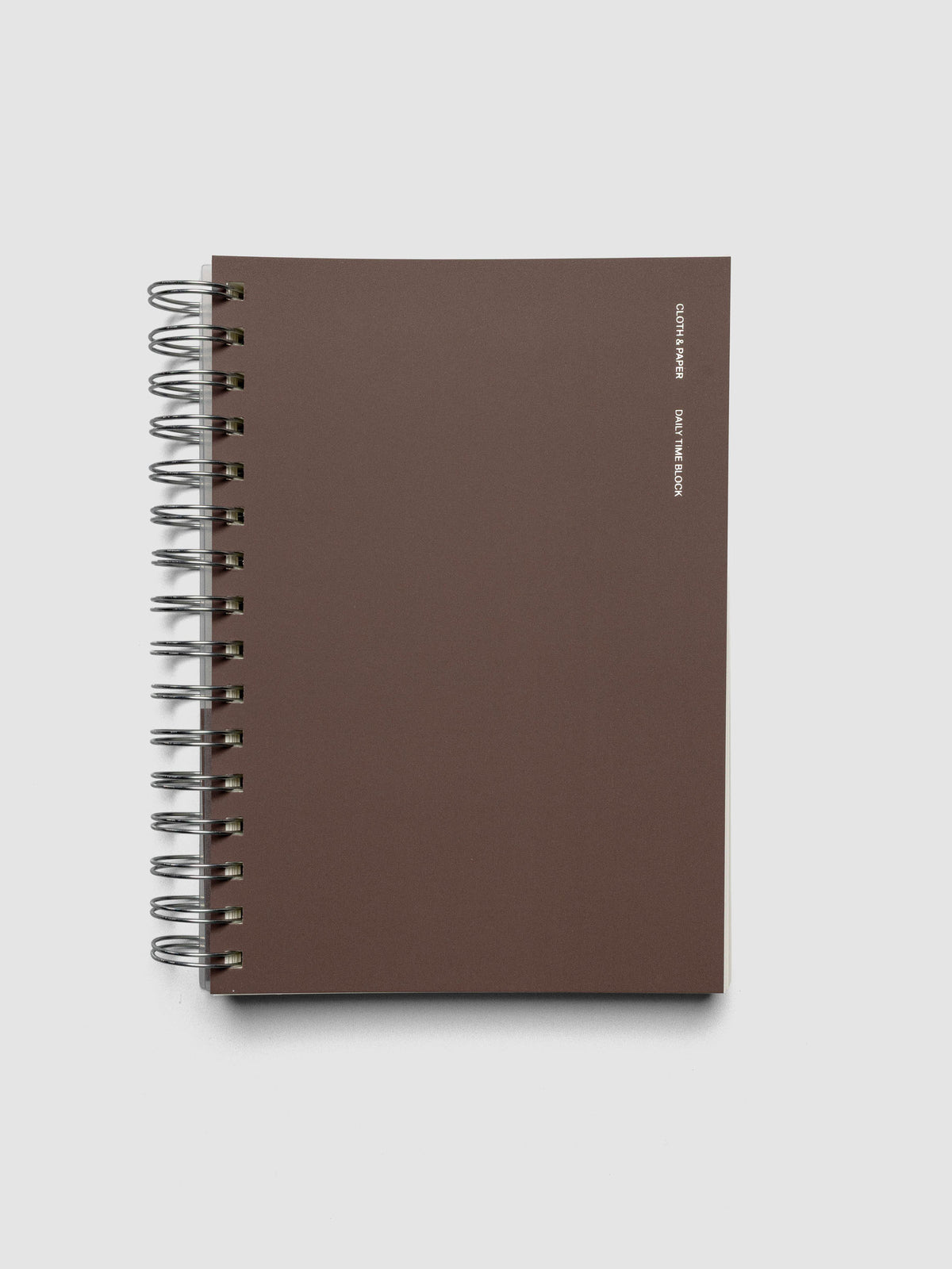 Spiral Notebook in size A5 and color Espresso brown with Daily Time Block interior pages shown closed.