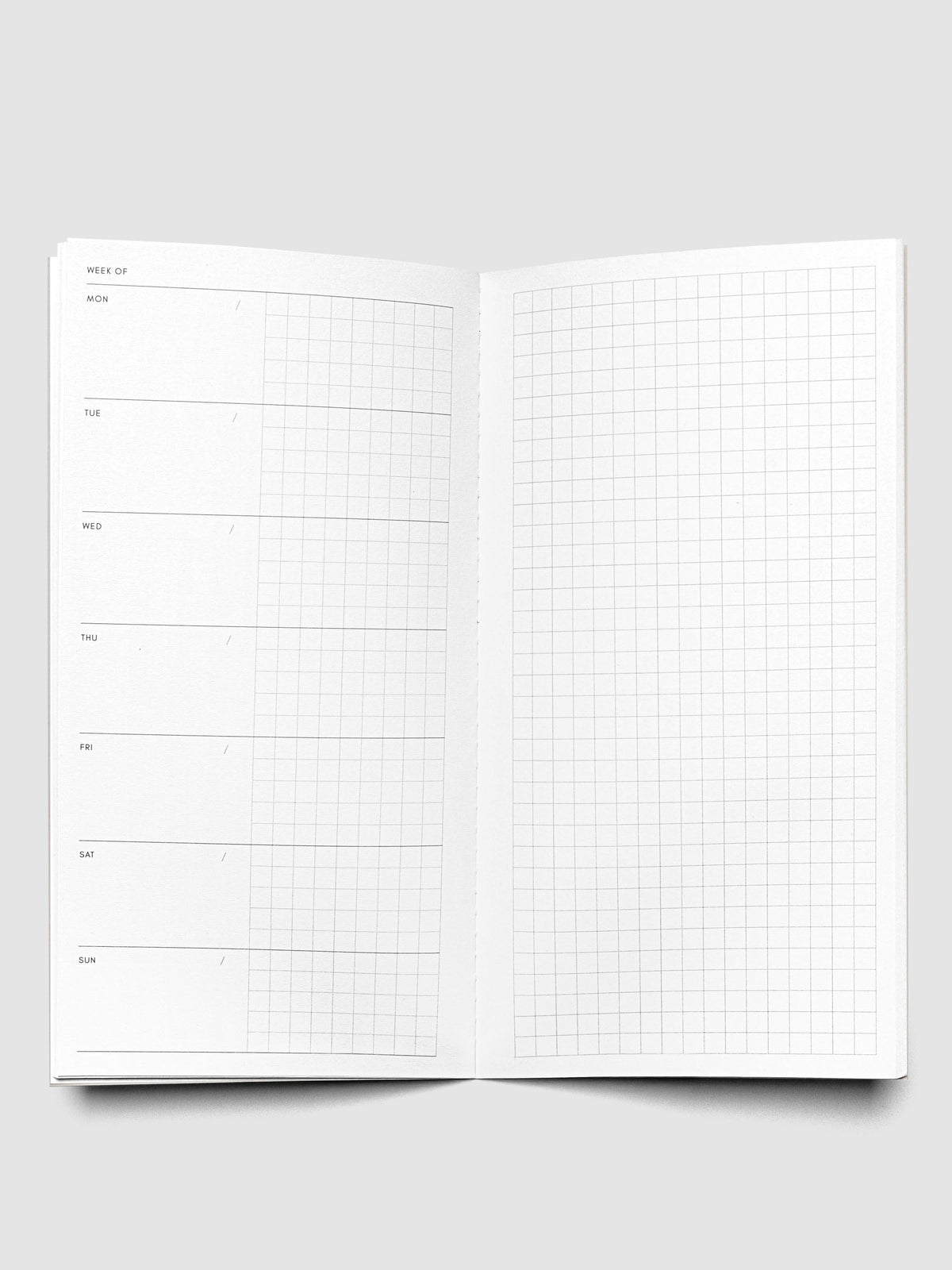 Interior of Travel Notebook in size A5 Slim in color Matcha with Weekly Graph pages.