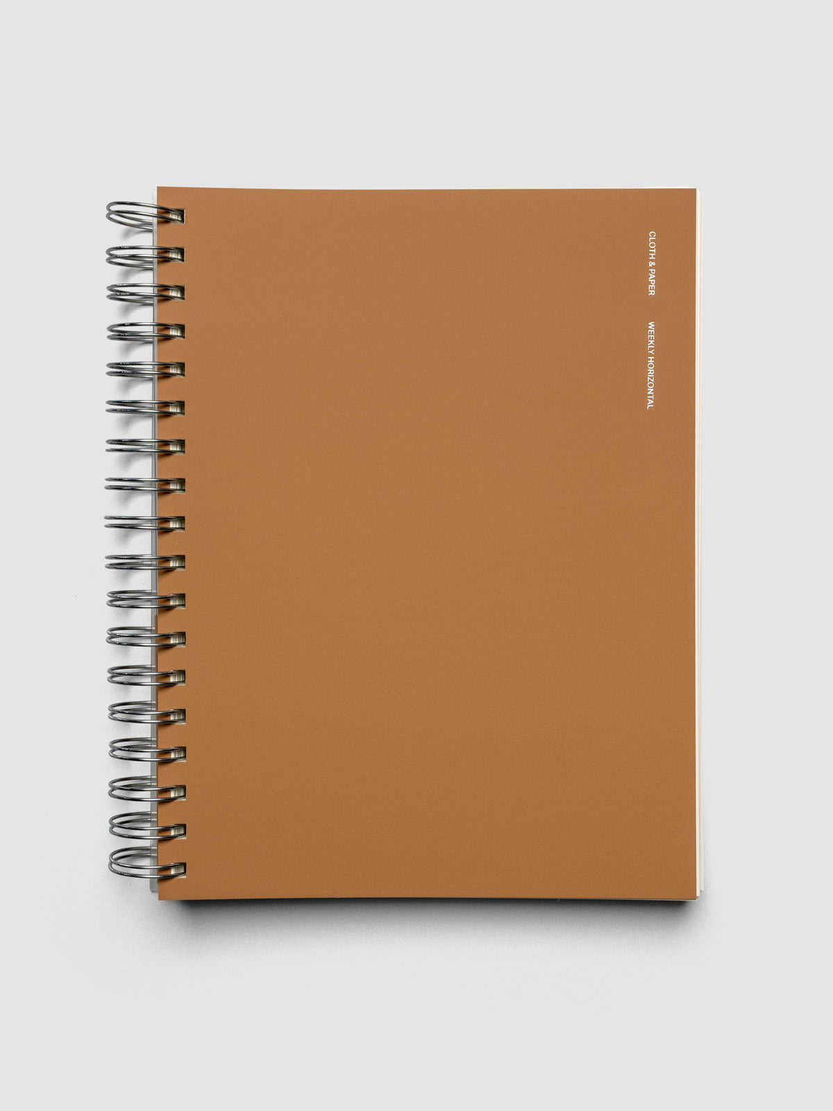 Spiral Notebook in size HP Classic and color Moscow (orange) with Weekly Horizontal interior layout shown closed.