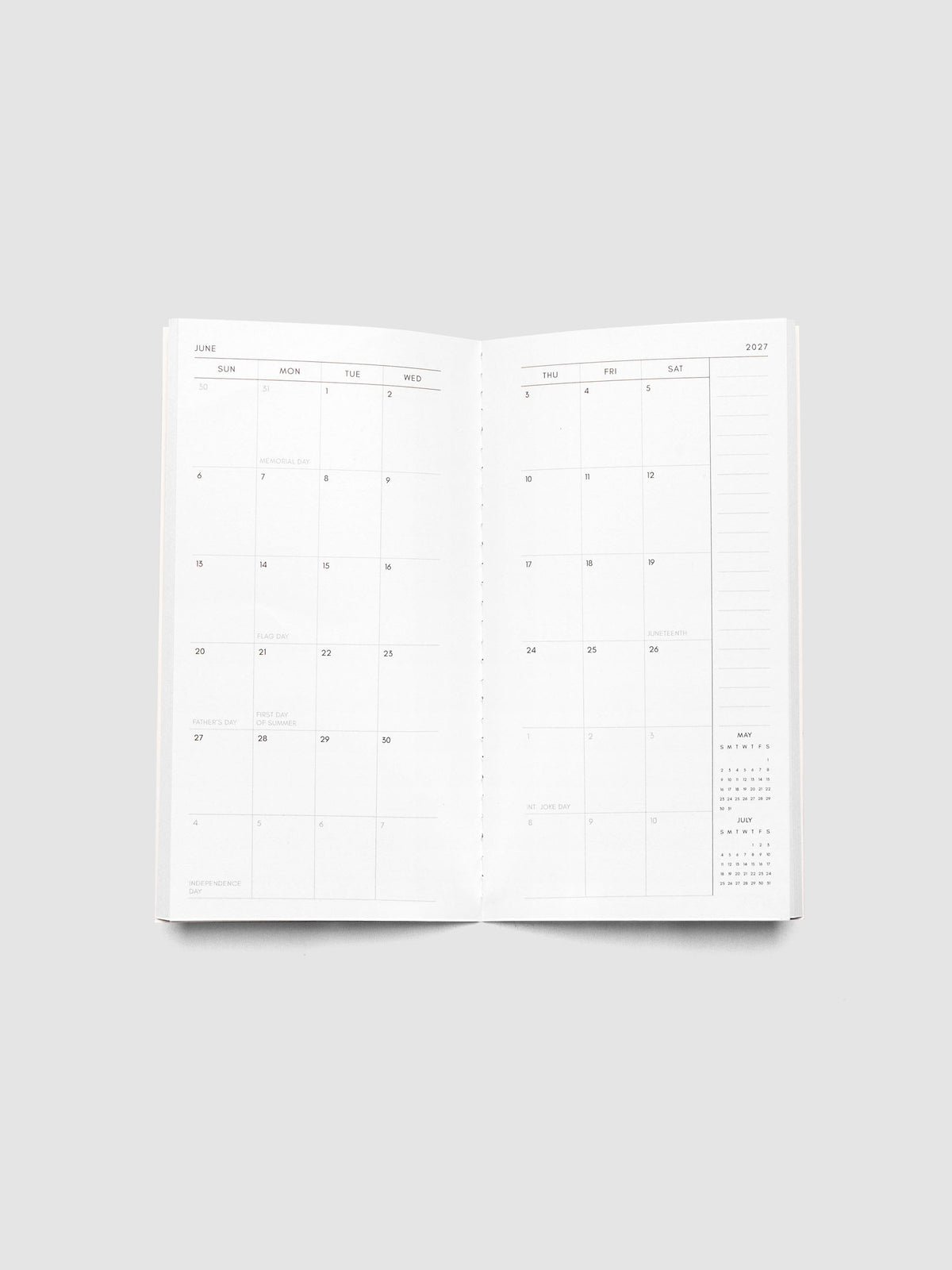 Open 2027 Dated Travel Notebook Monthly in Pocket Plus size showing the full two-page dated calendar spread