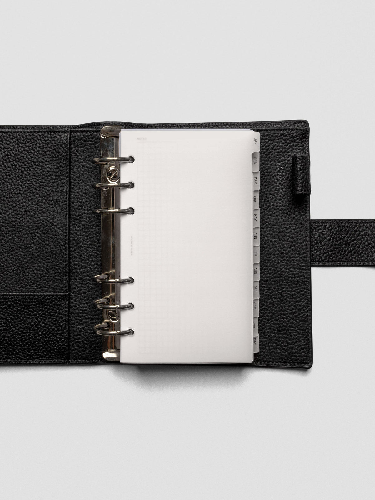 Personal vellum dividers shown bound with rings in an agenda.
