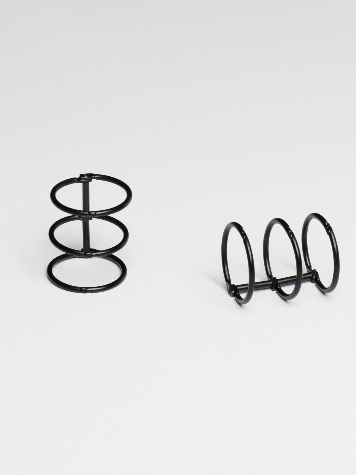 Planner rings displayed on a neutral background. Color shown is black.