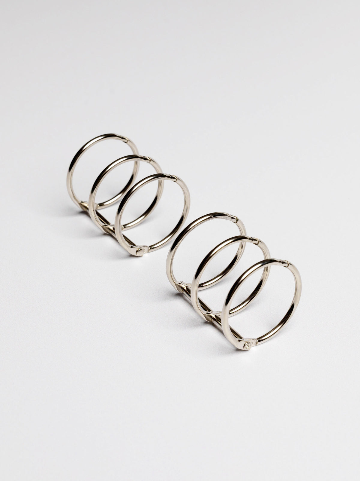 Planner rings displayed on a neutral background. Color shown is silver.