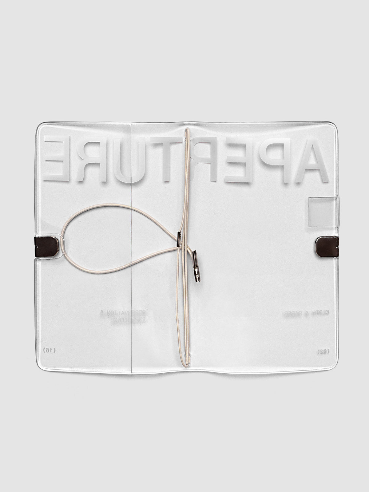 Aperture Travel Notebook Cover in Pocket Plus size, open, showing four grey interior bands, pen loop, and front pocket