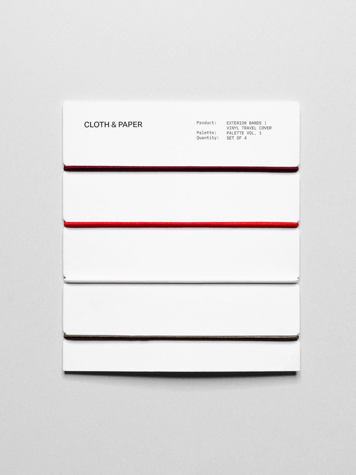 Set of travel bands displayed in their packaging on a neutral background.