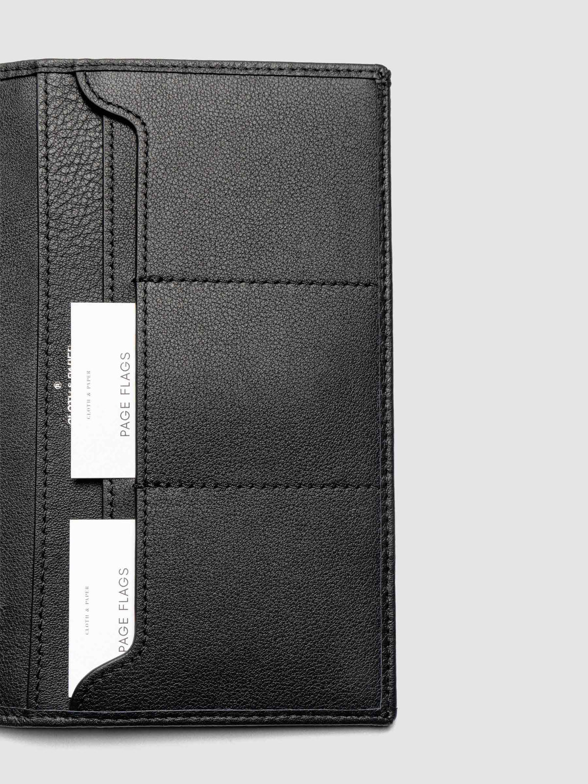 Close-up of Nomada Wallet credit card slots in Padrillo with page flags tucked inside