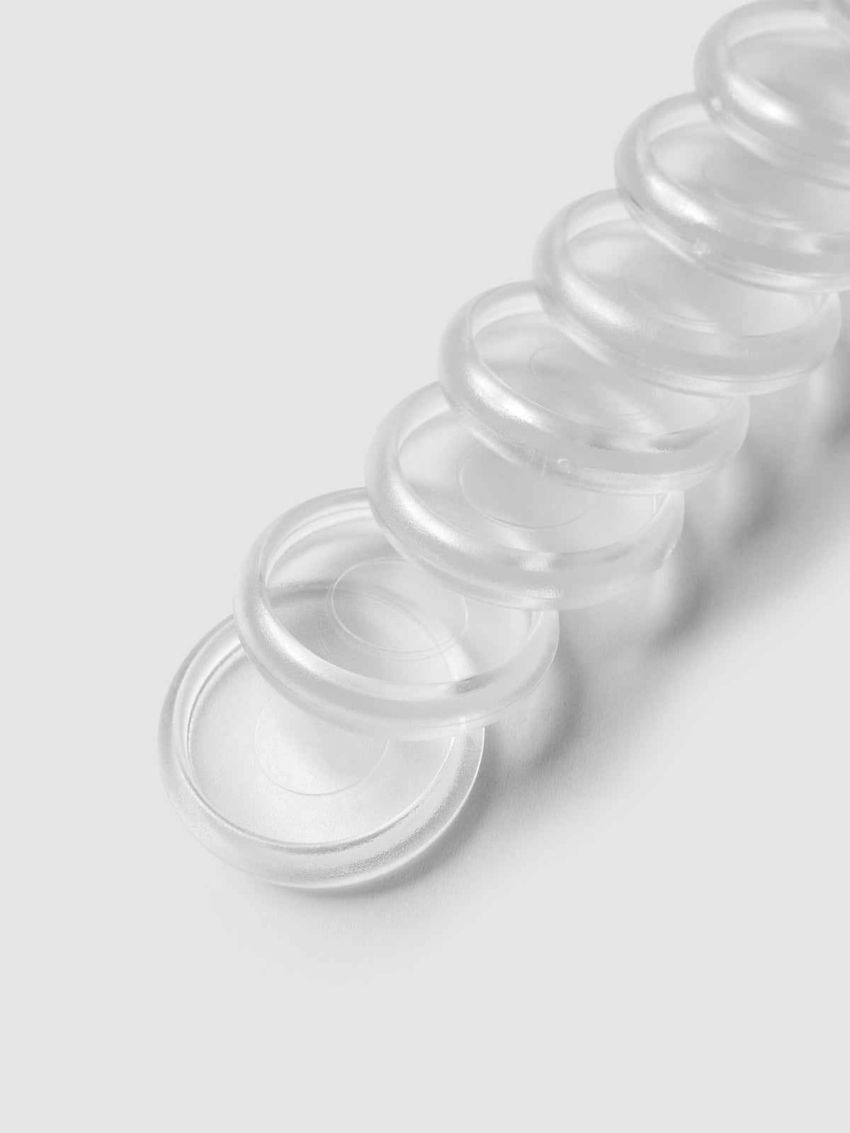 Close up view of 1 inch clear, transparent planner discs.