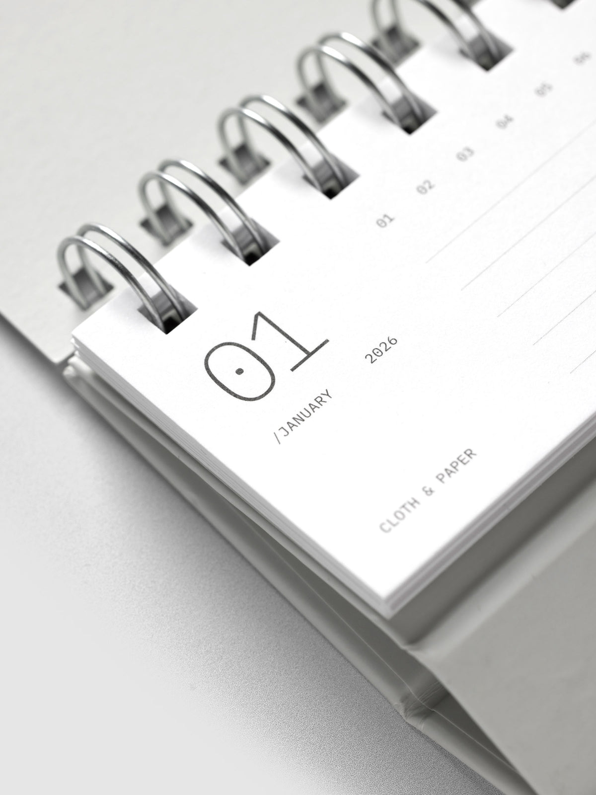 Close up of 2026 Spiral Desk Calendar shown folded and flat, displaying a calendar page.