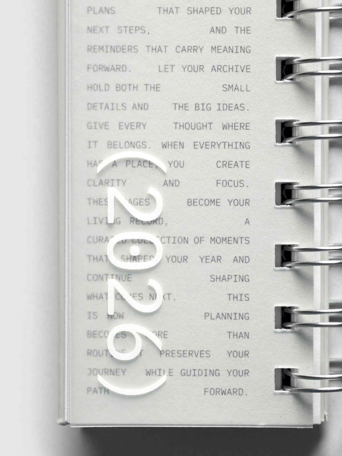 Close up of exterior of 2026 Spiral Desk Calendar displaying 2026 text.