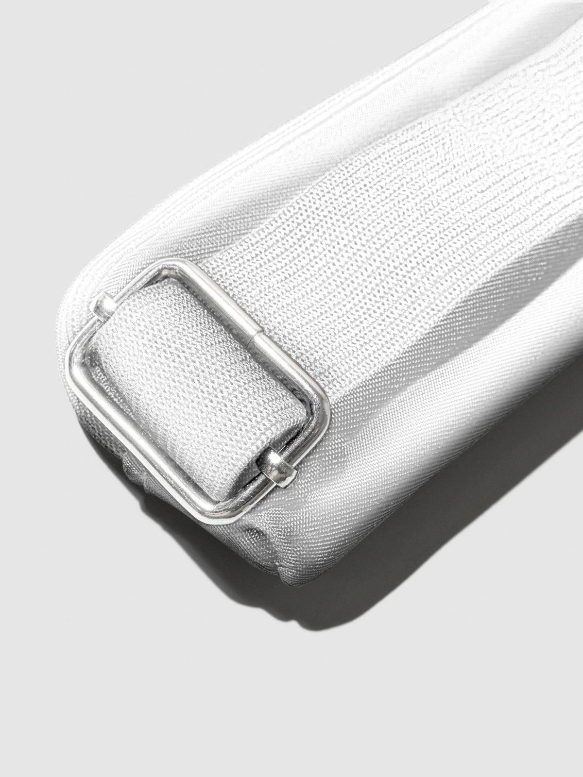 Closeup of strap on Le Blanc pouch.