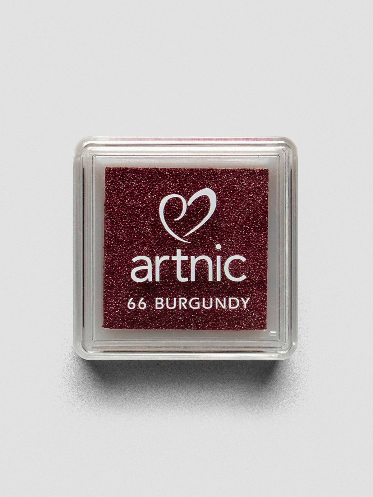 Square burgundy Artnic ink pad with clear lid labeled “66 Burgundy,” viewed from above.