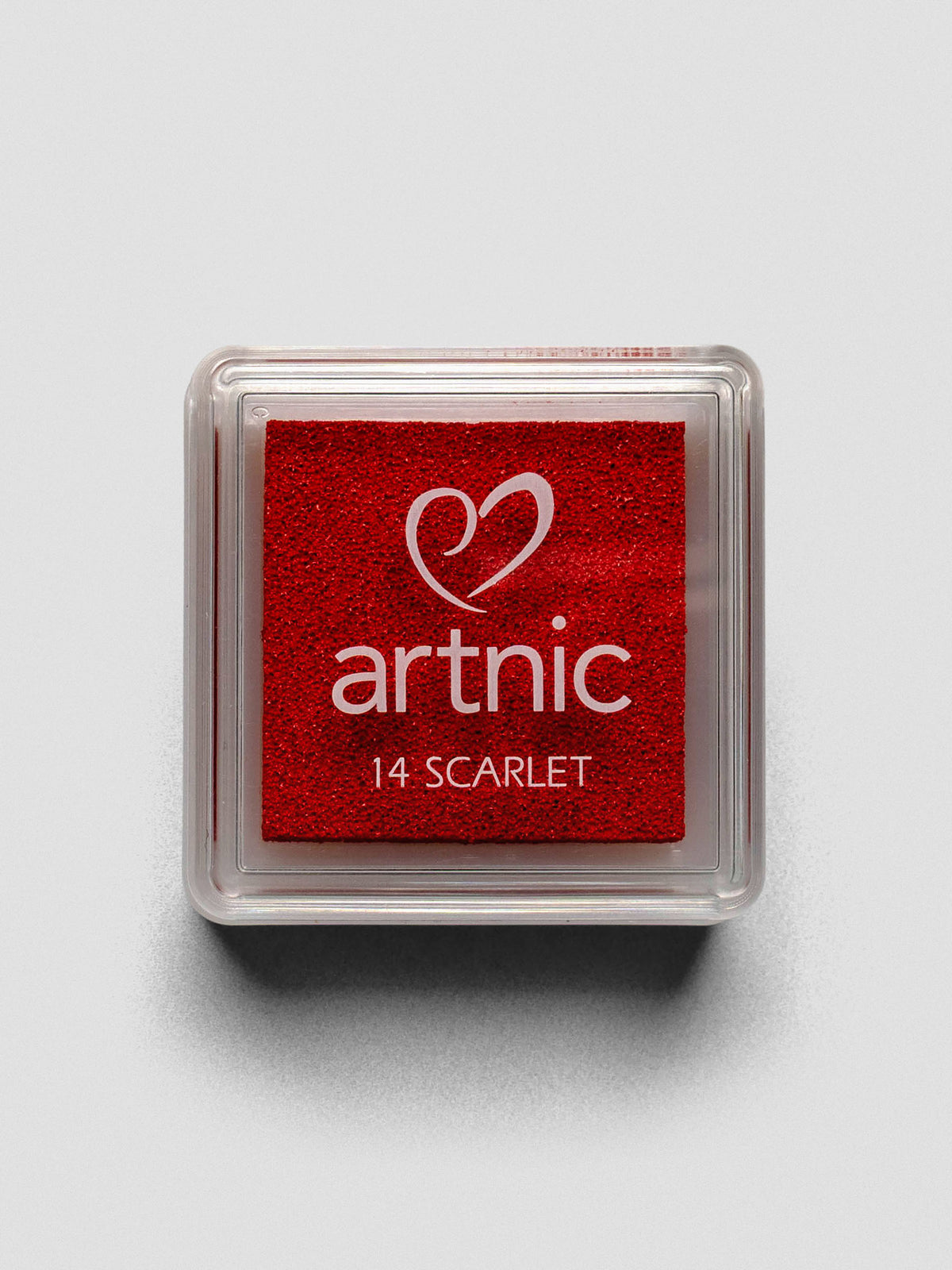 Square red Artnic ink pad with clear lid labeled “14 Scarlet,” viewed from above.