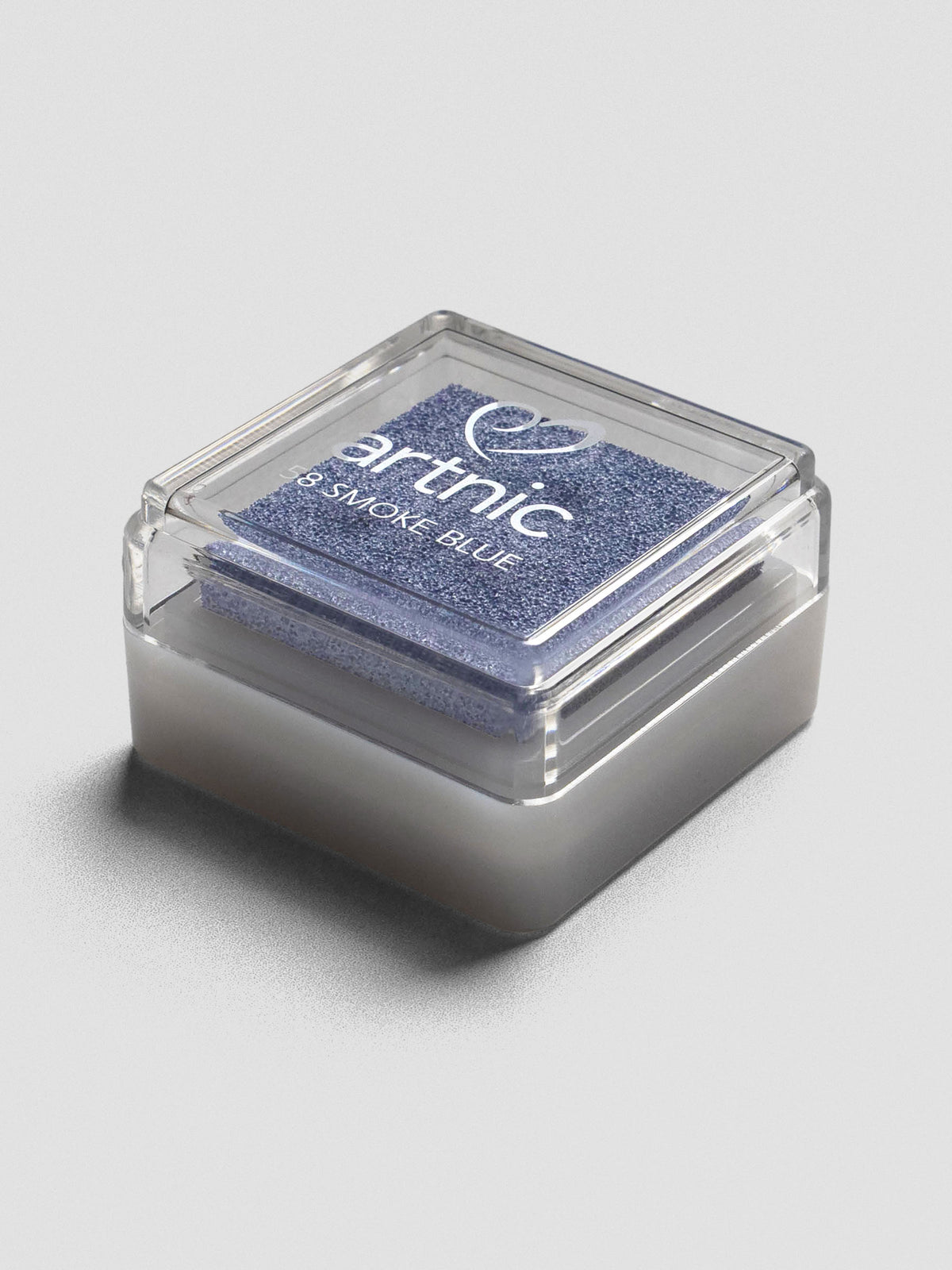 Light blue Artnic ink pad with clear lid, angled view showing its stackable design.