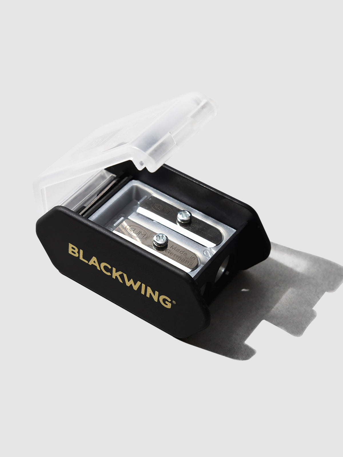 The image shows a close-up of the blackwing long point pencil sharpener showing the blades and the frosted cover.