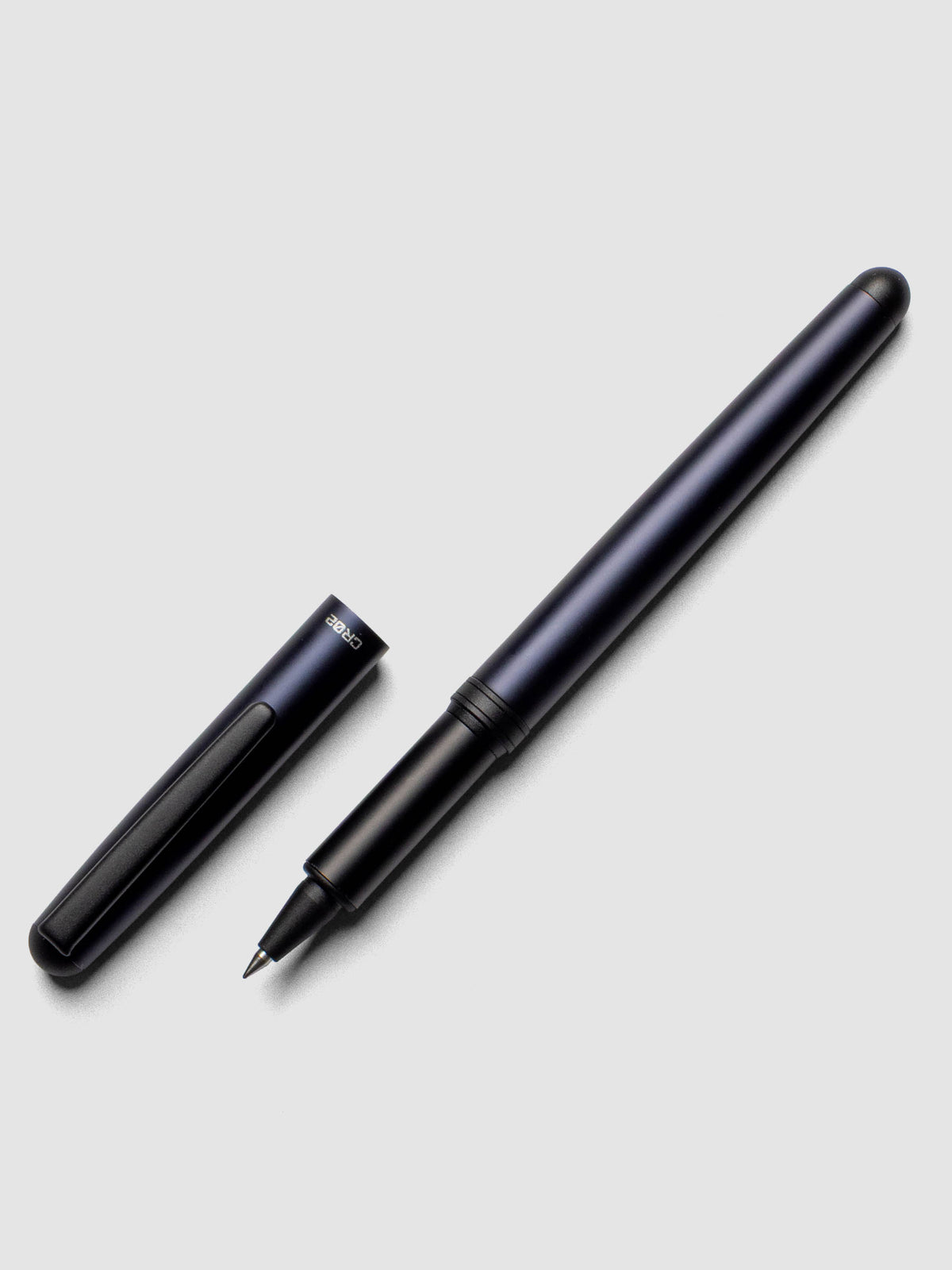 OHTO CR02 Ceramic Rollerball Pen | 0.5 mm shown in matte blue with cap off.