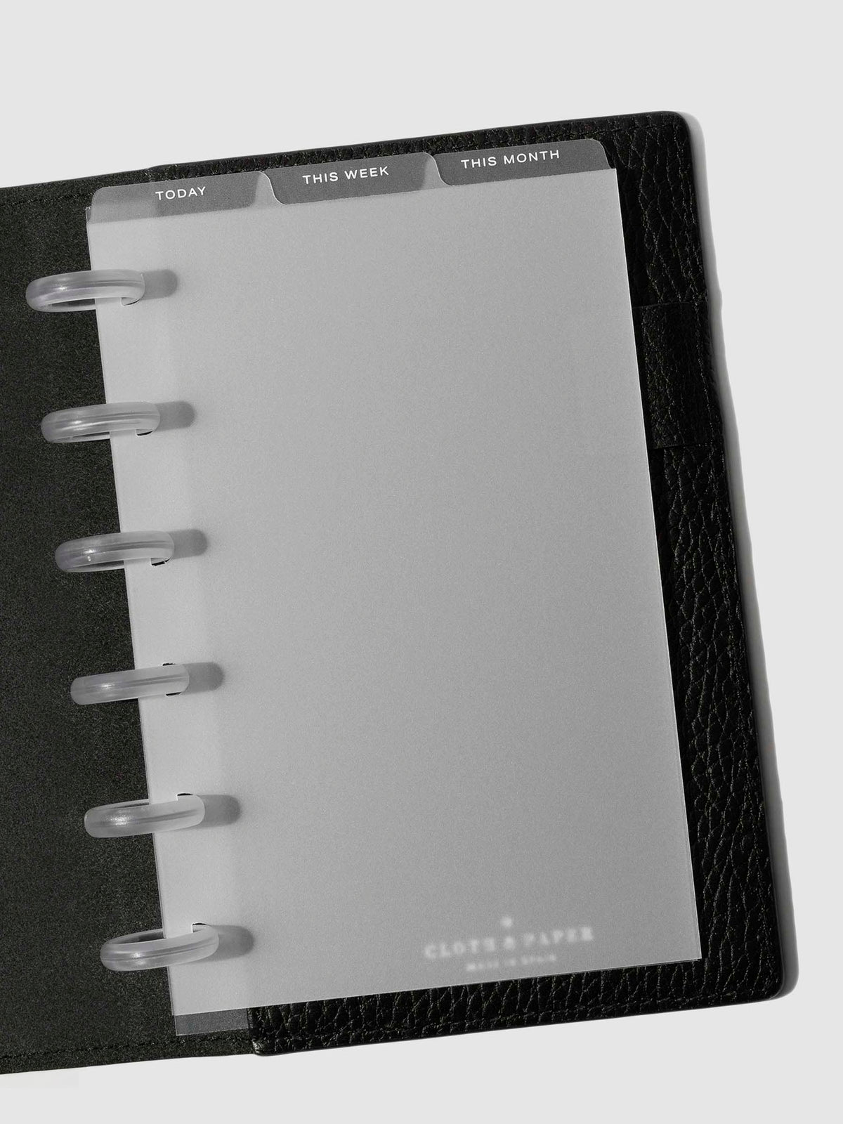 CP Petite White Foil Cadence Tab Dividers displayed in a black leather planner.