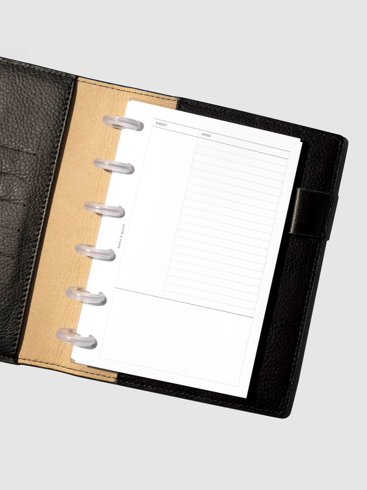 Insert in use inside a black leather folio.