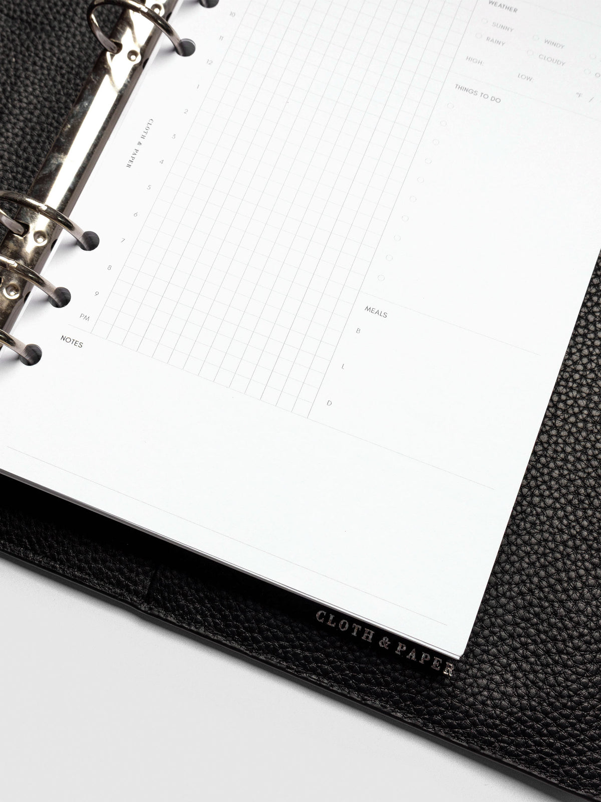 Insert in use inside a black leather folio.