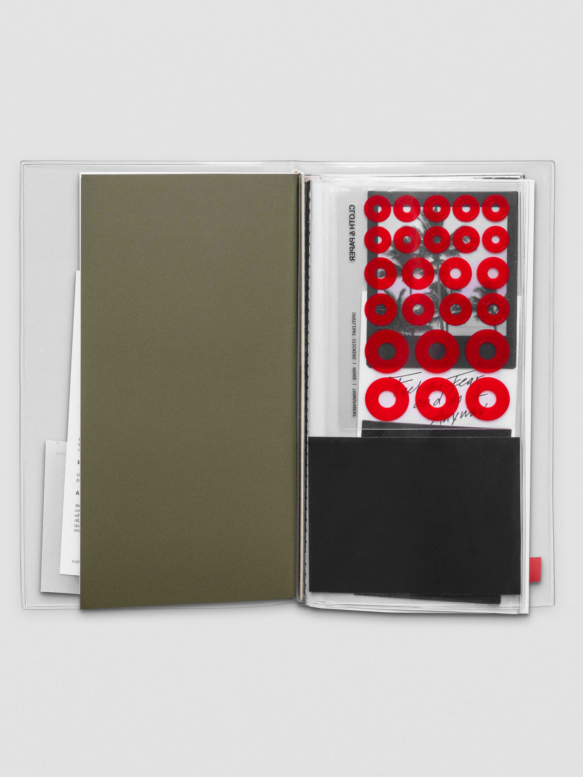 Planner spread showing A5 Slim document pocket holding paper items inside.