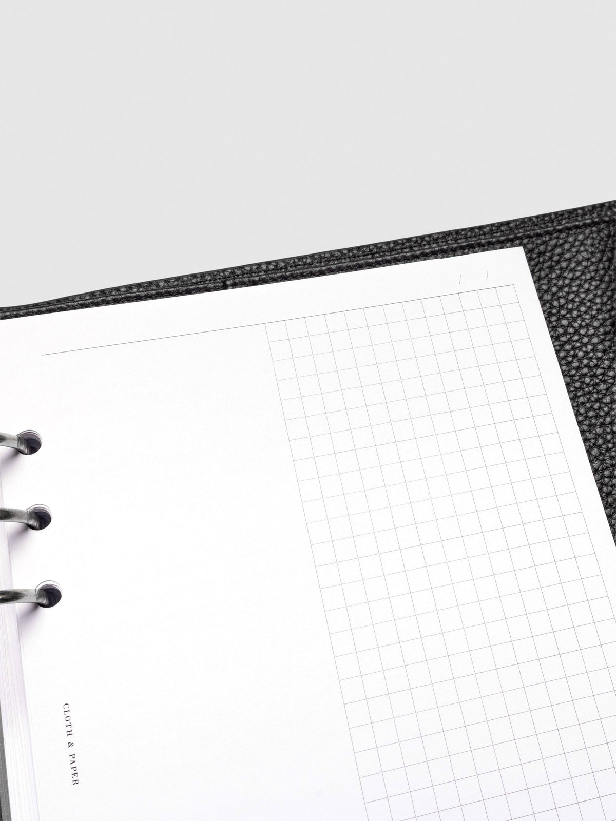 Inserts in use inside a black leather planner.