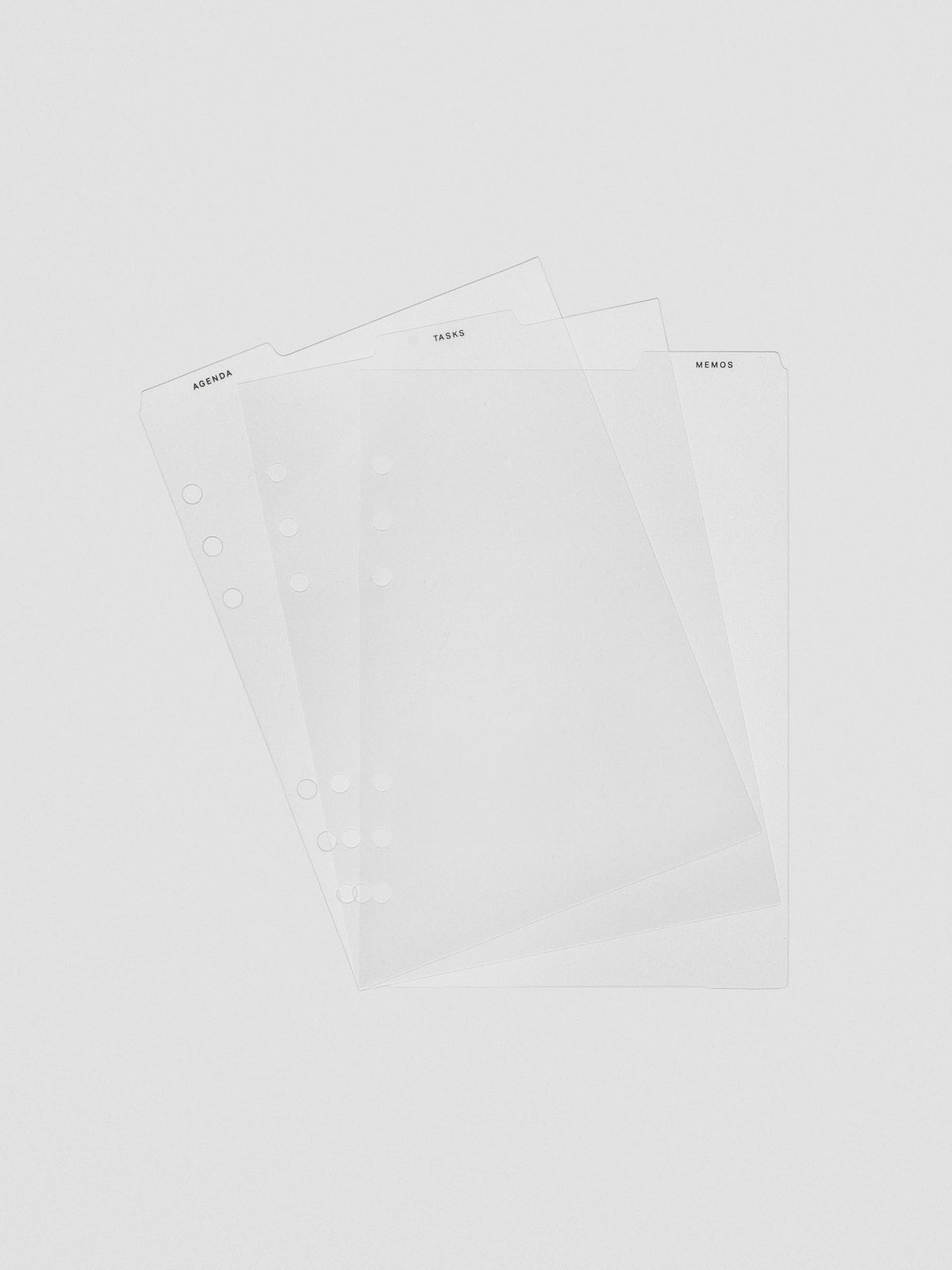 Set of three ultra-thin clear planner dividers fanned out, each with a top tab labeled Agenda, Tasks, or Memos.
