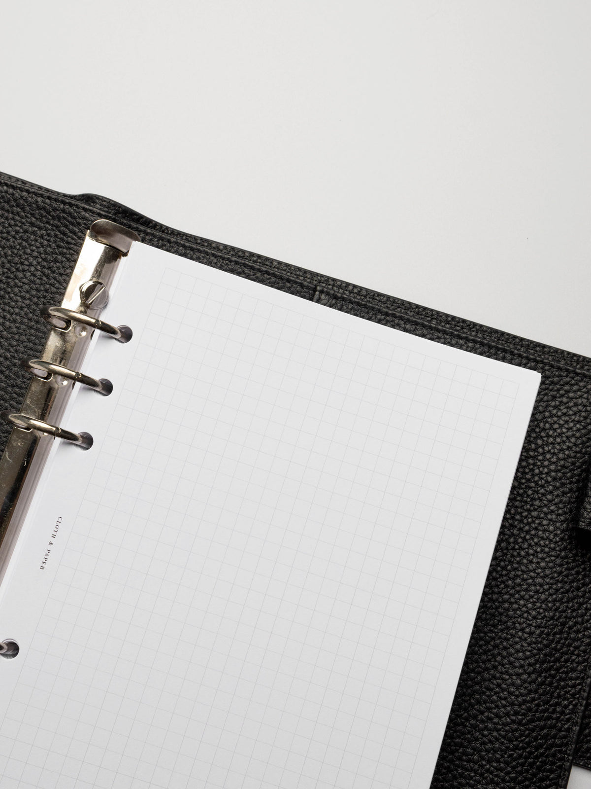 Insert in use inside a black leather planner.