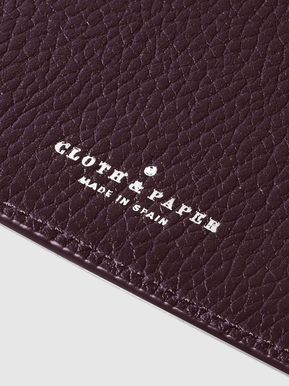 Closeup of silver stamping on leather folio.