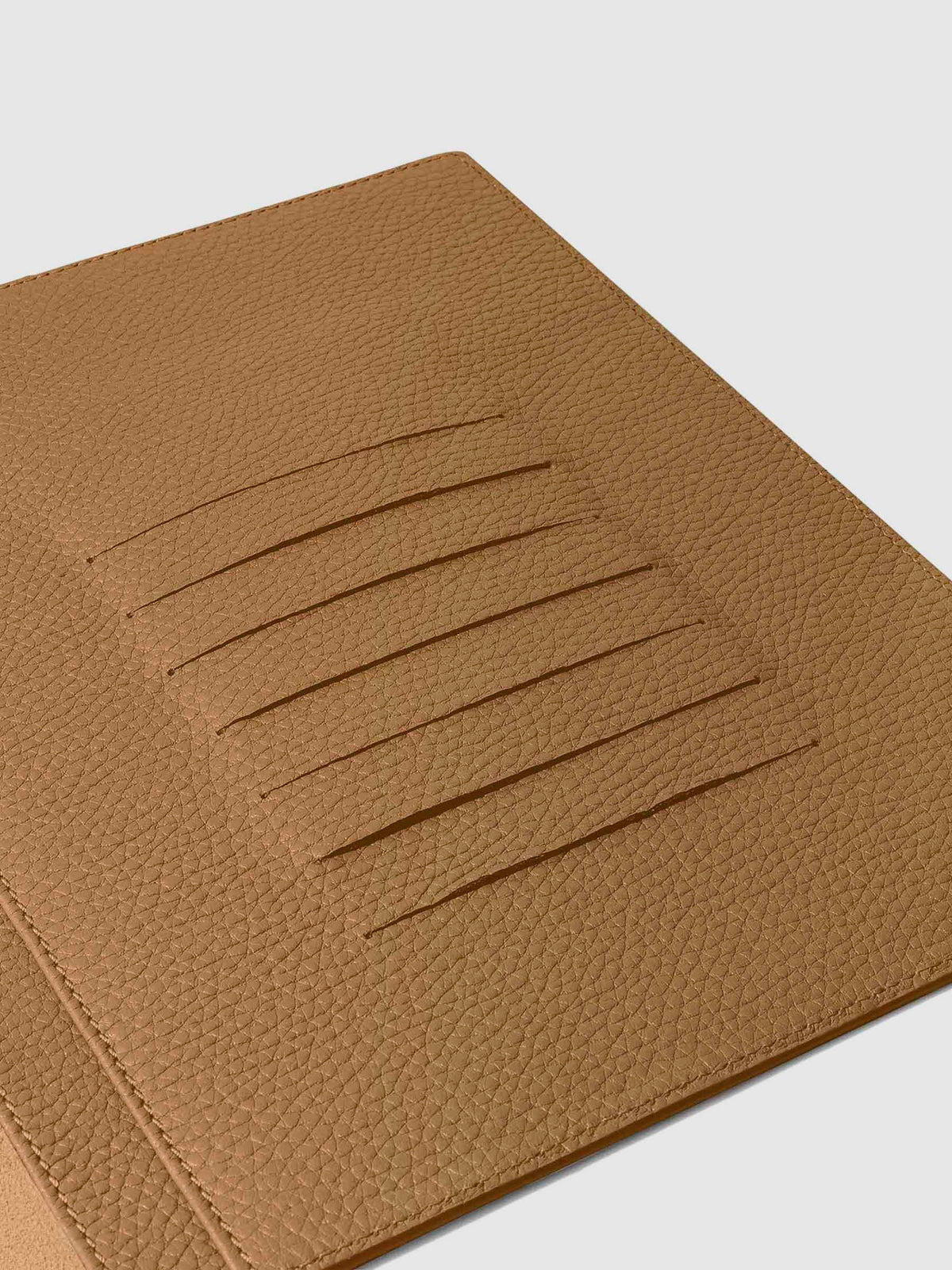 Closeup of credit card slots inside leather folio.