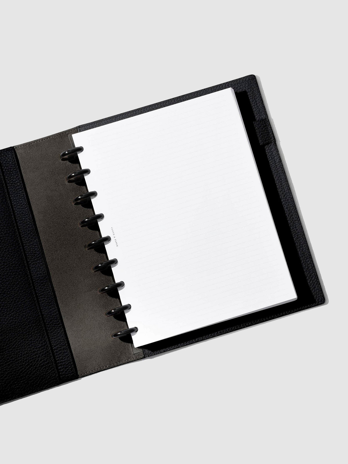 Folio displayed opened on a neutral background.