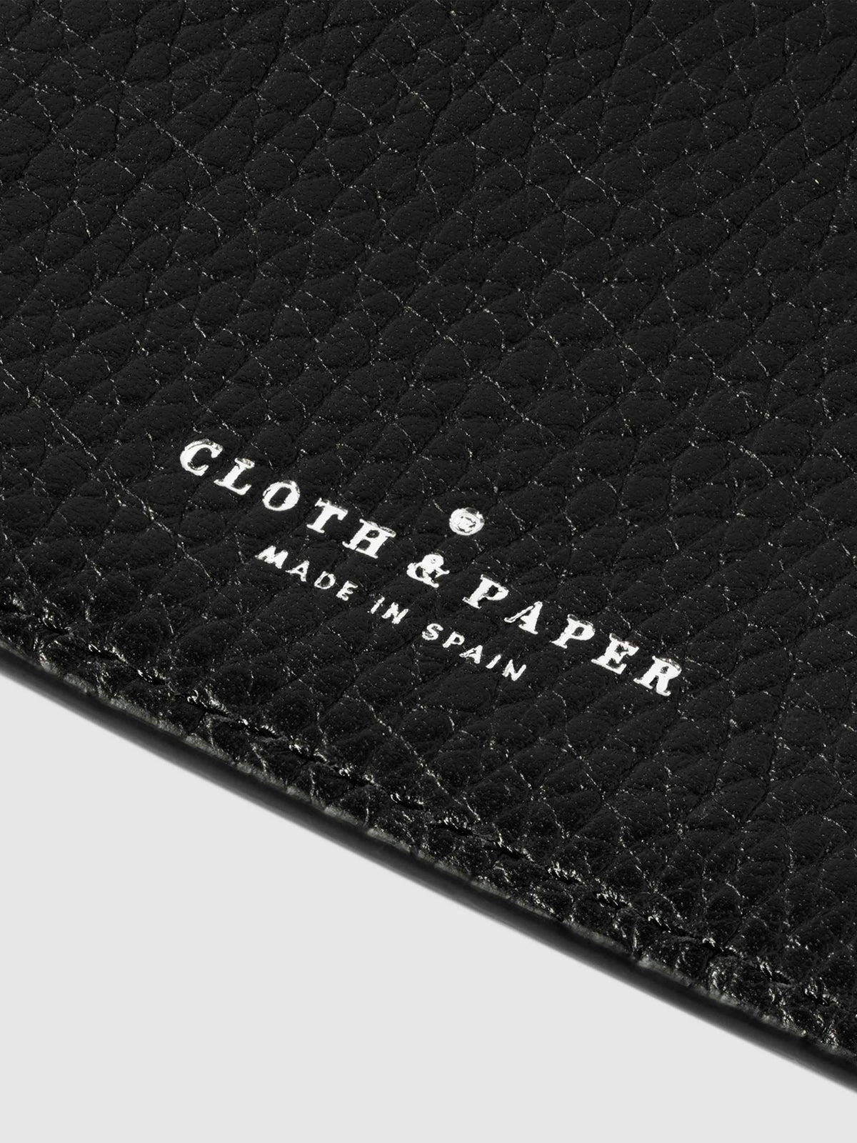 Closeup of Padrillo folio's foil-stamped Cloth and Paper Made in Spain logo.