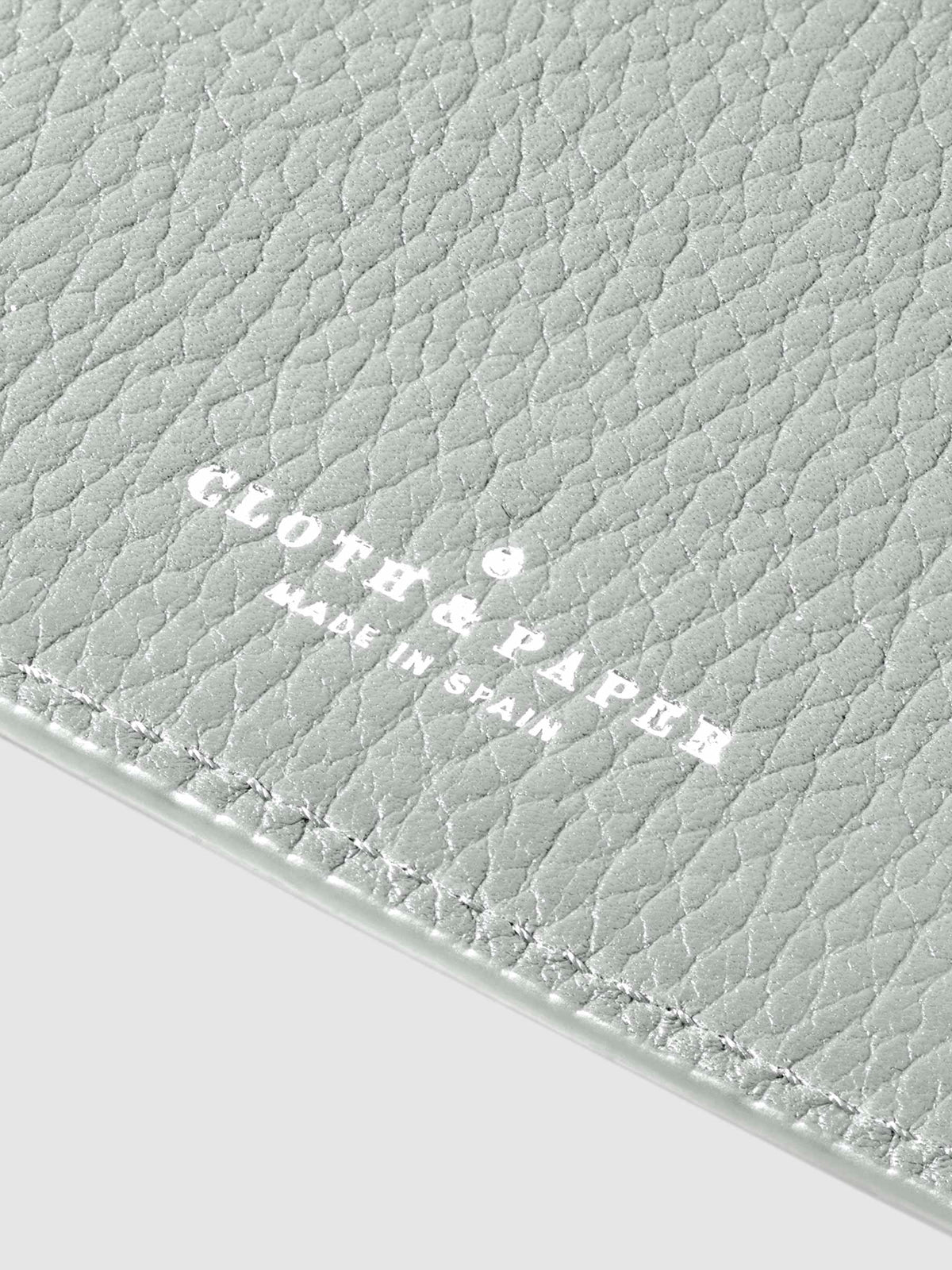 Closeup of Veleta folio's foil-stamped Cloth and Paper Made in Spain logo.