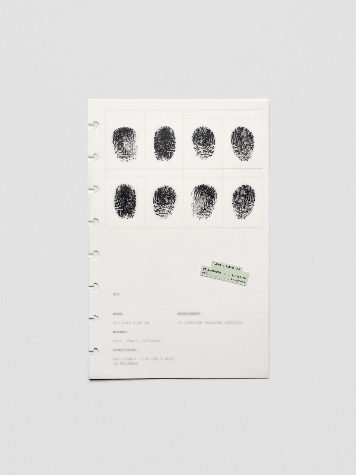 Two layered Half Letter sized planner dashboards, one semi-transparent, one matte, featuring a fingerprint design.